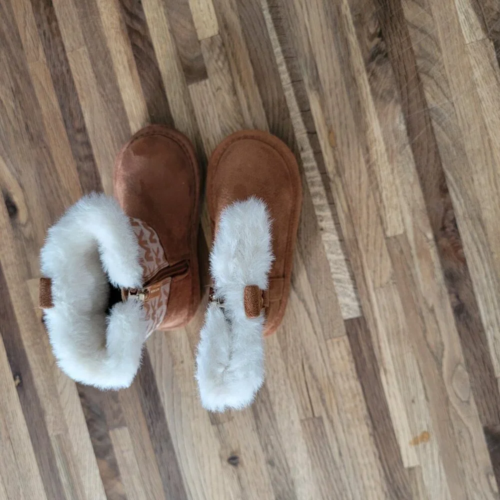 Michael Kors Yancy Girl Toddler boots featuring a brown logo print and faux fur